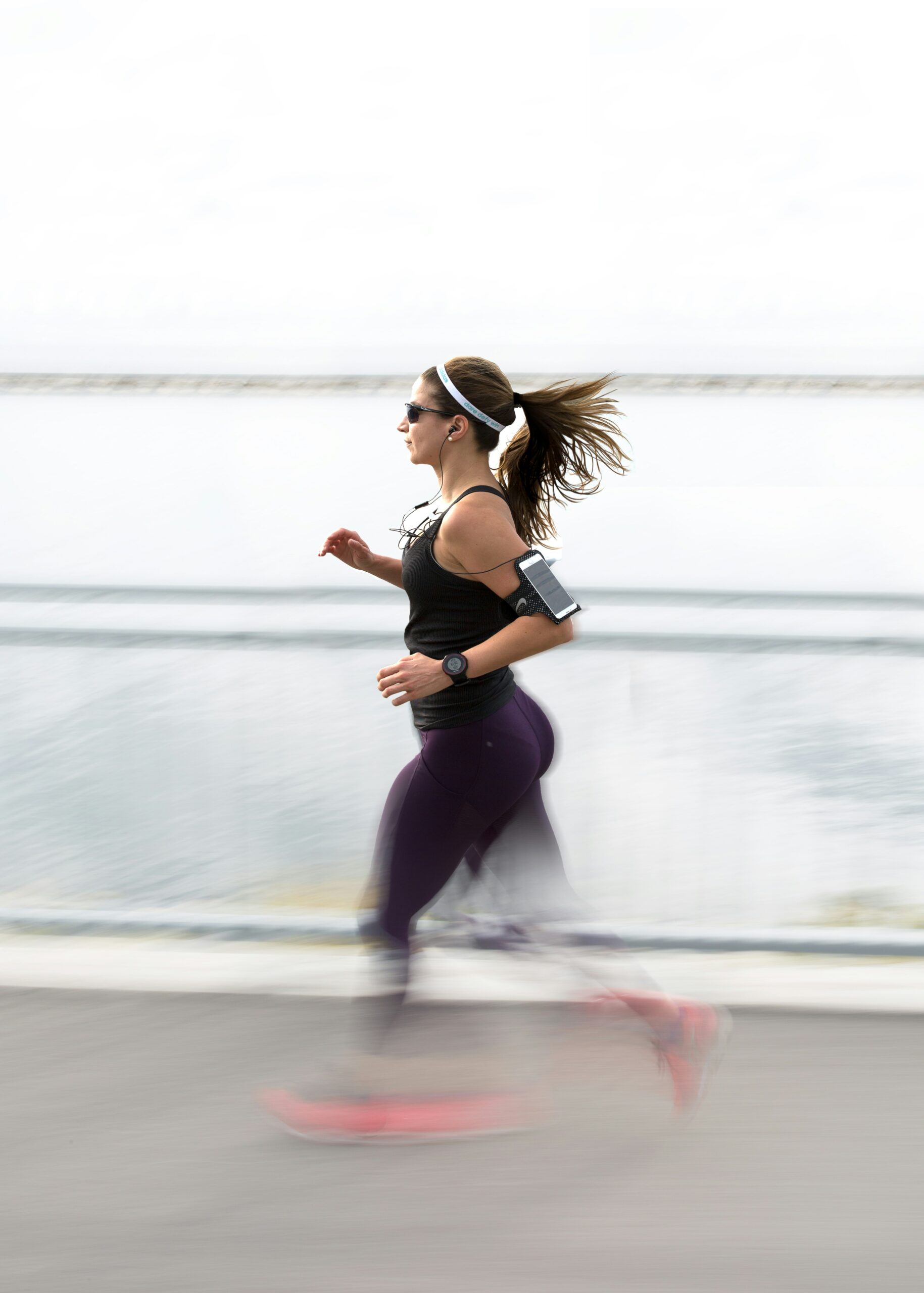 Runner running along a boardwalk