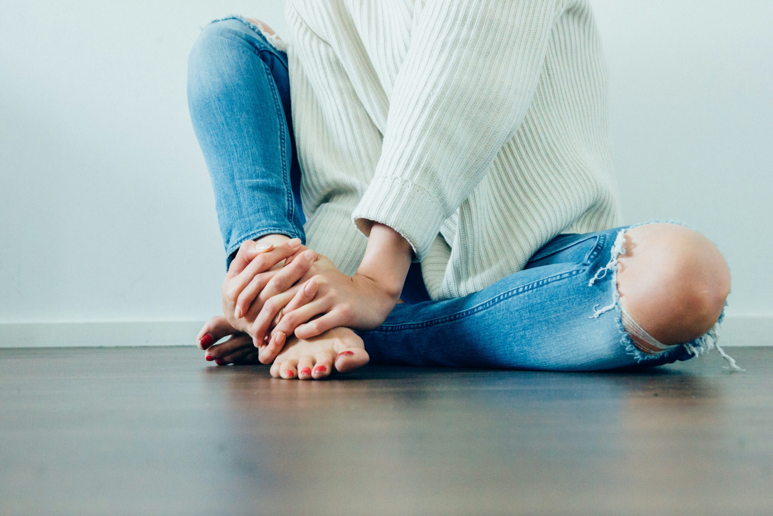 stressed out lady sitting on the floor