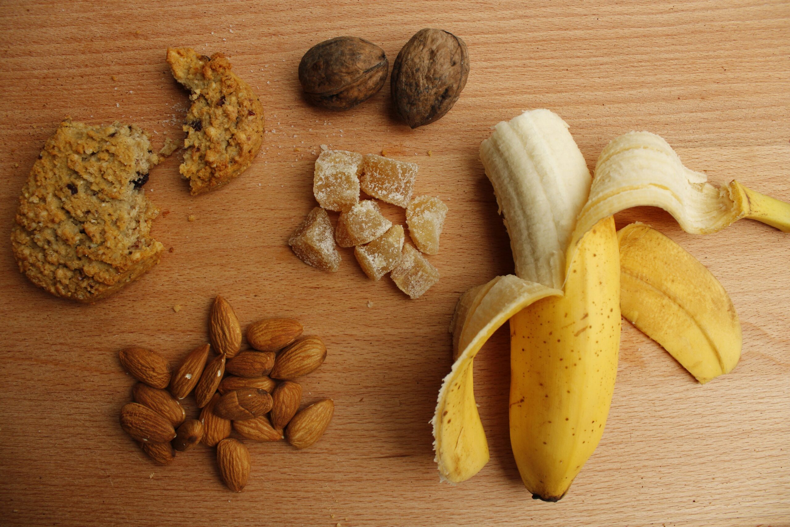 Allergen foods laying out on wooden countertop nuts adn legumes dietetics