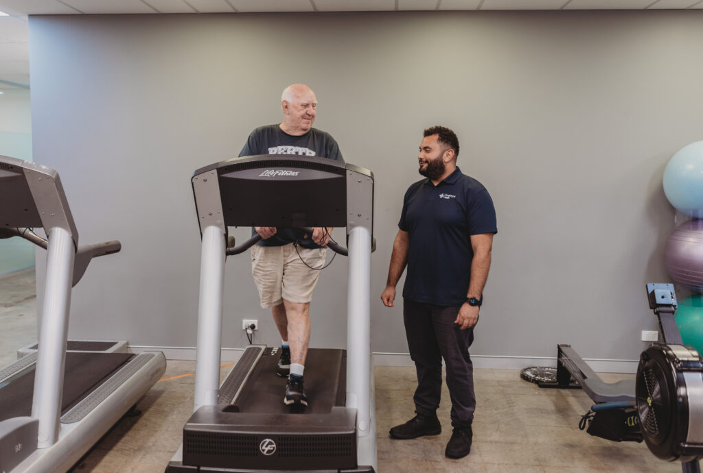 Physiotherapist and Exercise Physiologist exercising with patient