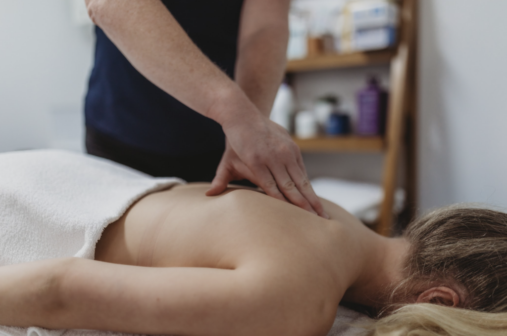 Massage therapist with patient